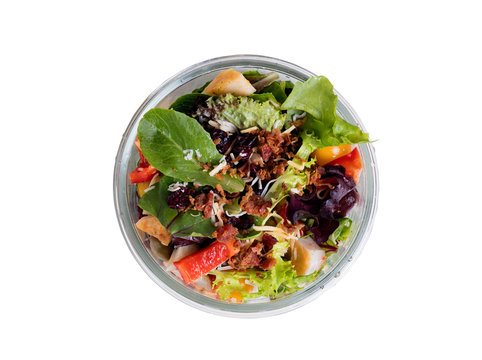 Top View Of Mixed Salad In Glass Container Isolated On White 