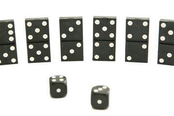 dominoes chips and dices on white