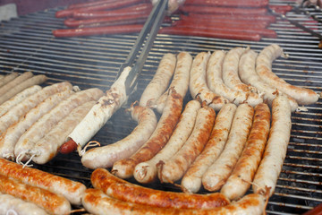 Street fast food, grilled sausages at bbq