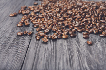 Coffee beans on wood background