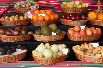 Fresh ripe exotic tropical fruits on shelves in Mercado dos Lavradores, Funchal, Madeira island, Portugal.