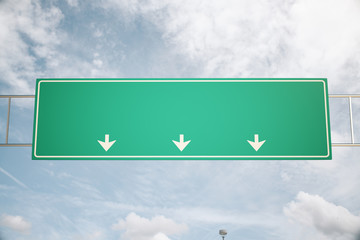 Highway sign on sky background