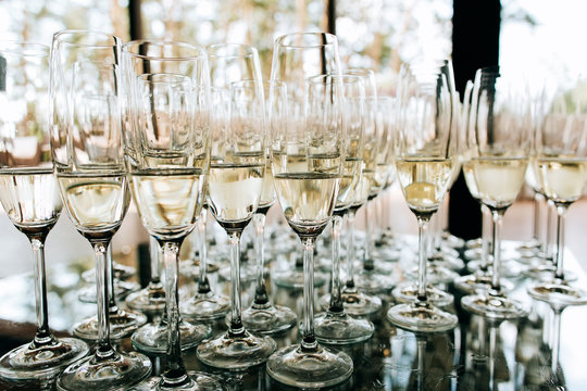 Champagne glasses closeup, Wedding reception alcohol drink table