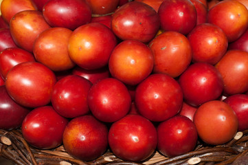 Ripe fresh tamarillo (english tomato, tamarilho) in basket.