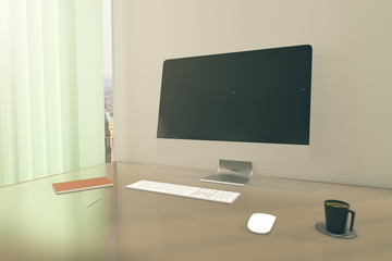 Office desktop with blank monitor