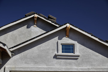 New home construction double gable roof and stucco