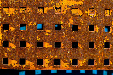 Rusty plate with square holes