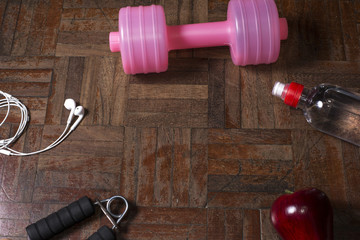 Fitness concept with bottle of dumbbell and hand grip