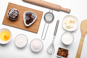 Cake ingredients on white table. Flat lay