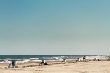 Several huts on empty beach at Argentina