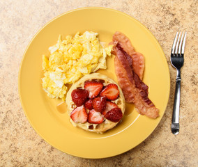 Bacon egg and waffle breakfast