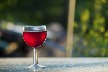 bright red wine in the glass on the table