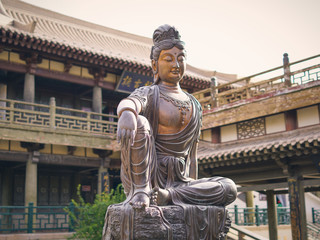 Buddha Statue at the Crescent Moon Pagoda in Dunhuang on the Silk Road (Gansu Province, China)