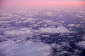 aerial view of dawn pink cloud from plane