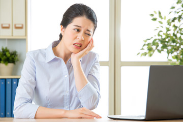 Young asian business woman with toothache