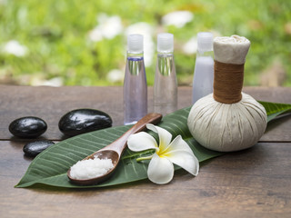 Fototapeta premium Spa massage compress balls, herbal ball on the leaves with rock spa, Thailand, select focus 