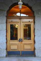 Fototapeta premium Classic stained wood door with hanging light