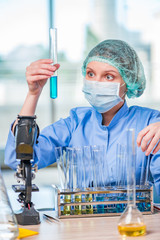 Experienced lab assistant working on chemical solutions