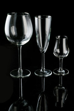 different glasses on a black background