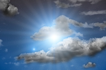 Milky Way stars with clouds on a dark sky.