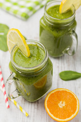 Vegetable and fruit cocktail, served in a jar, with fresh citrus