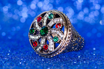 Jewellery ring against blue background