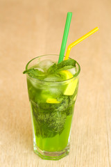 Mojito cocktail with mint garnish on white background