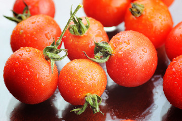 Water drops green and tomatoes