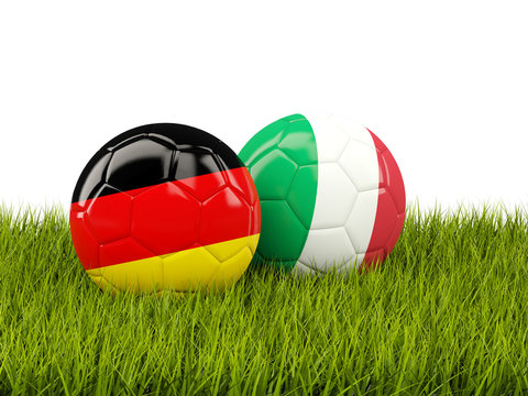 Italy and Germany soccer  balls on grass