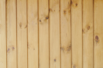 A wooden rail, wall, background.