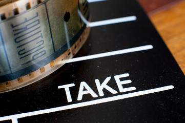 Take label on movie clapper and film reel