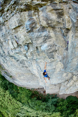 male rock climber. rock climber climbs on a rocky wall