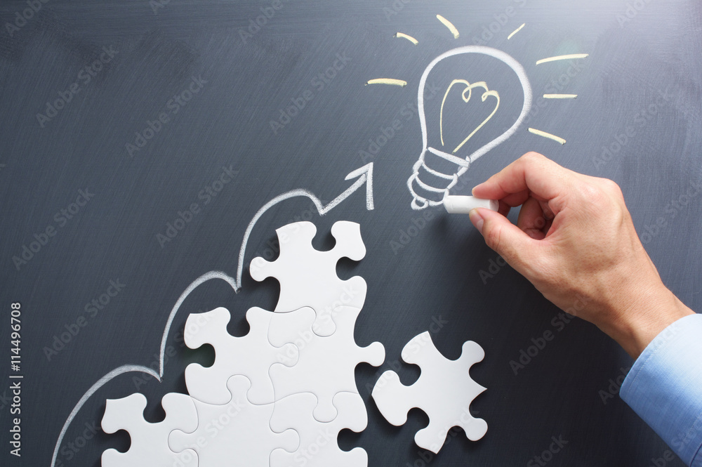 Poster Drawing light bulb on blackboard. Steps shaped jigsaw puzzle. Concept image of developing new idea.

