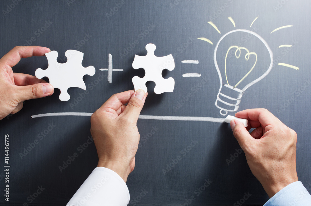 Aufkleber Solving puzzle together. Drawing light bulb on blackboard. Combining the wisdom for developing new idea.
