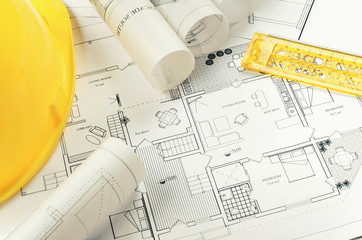 Architectural project and yellow helmet