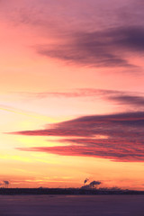red sunset over the winter river