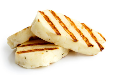 Three grilled slices of halloumi cheese isolated on white in perspective. With grill marks. - obrazy, fototapety, plakaty
