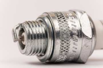 Spark plug closeup macro with white background