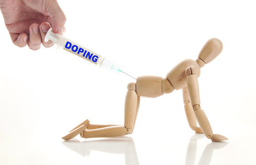 Concept of doping use. Abstract image with a wooden puppet