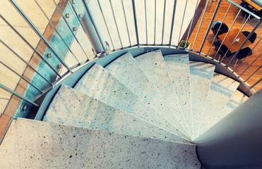 Fototapeta premium close up of stone spiral staircase at restaurant