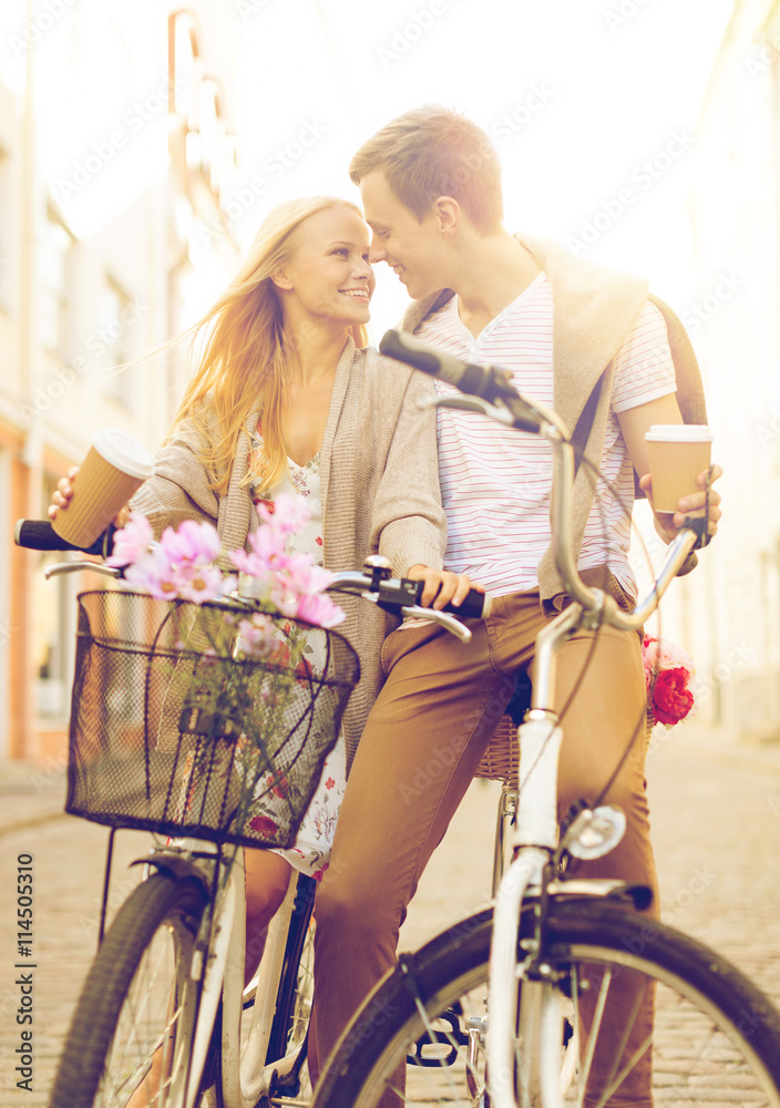 Wall mural couple with bicycles in the city