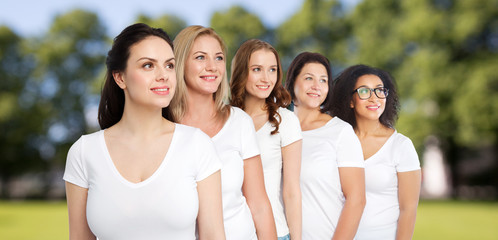group of happy different women in white t-shirts