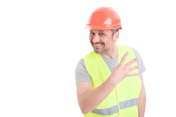 Handsome constructor holding four fingers up and smiling