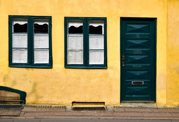 The facade of an old town house, in Elsinore Denmark, with yello