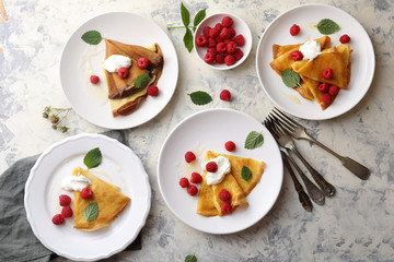 breakfast with pancake and berries on plates
