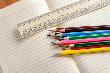 Crayons, a ruler and Notepad closeup