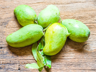 Fresh Green mango(Rhino Mango) on wood background