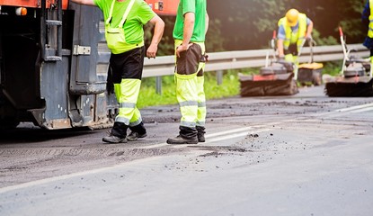Fototapeta premium Summer road work. Road renewal.