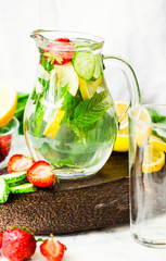 Water with strawberries, lemon, ice, mint. Detox.