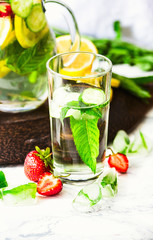 Water with strawberries, lemon, ice, mint. Detox.